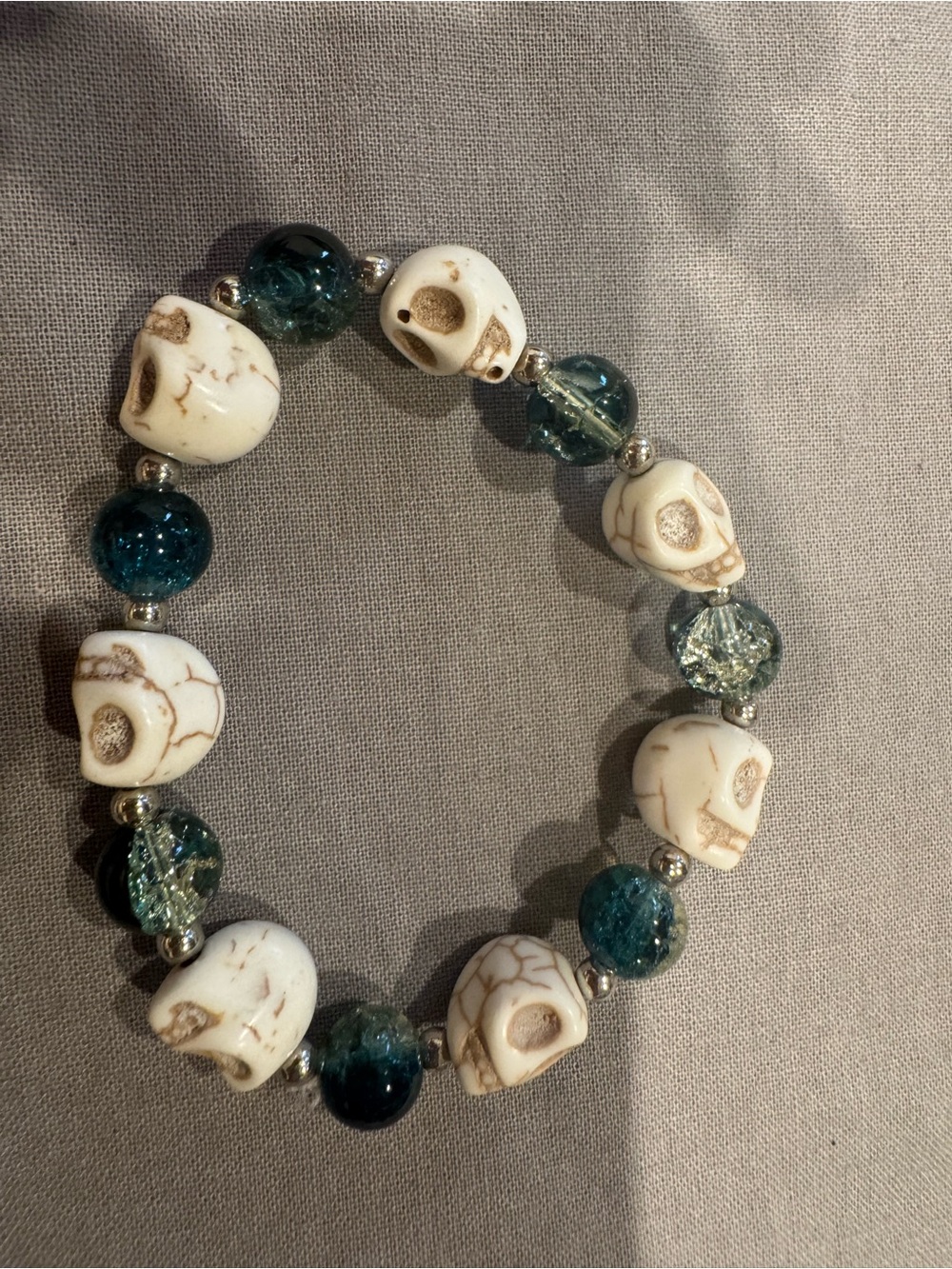 White Skull Bead Stretch Bracelet with Teal Glass Accents